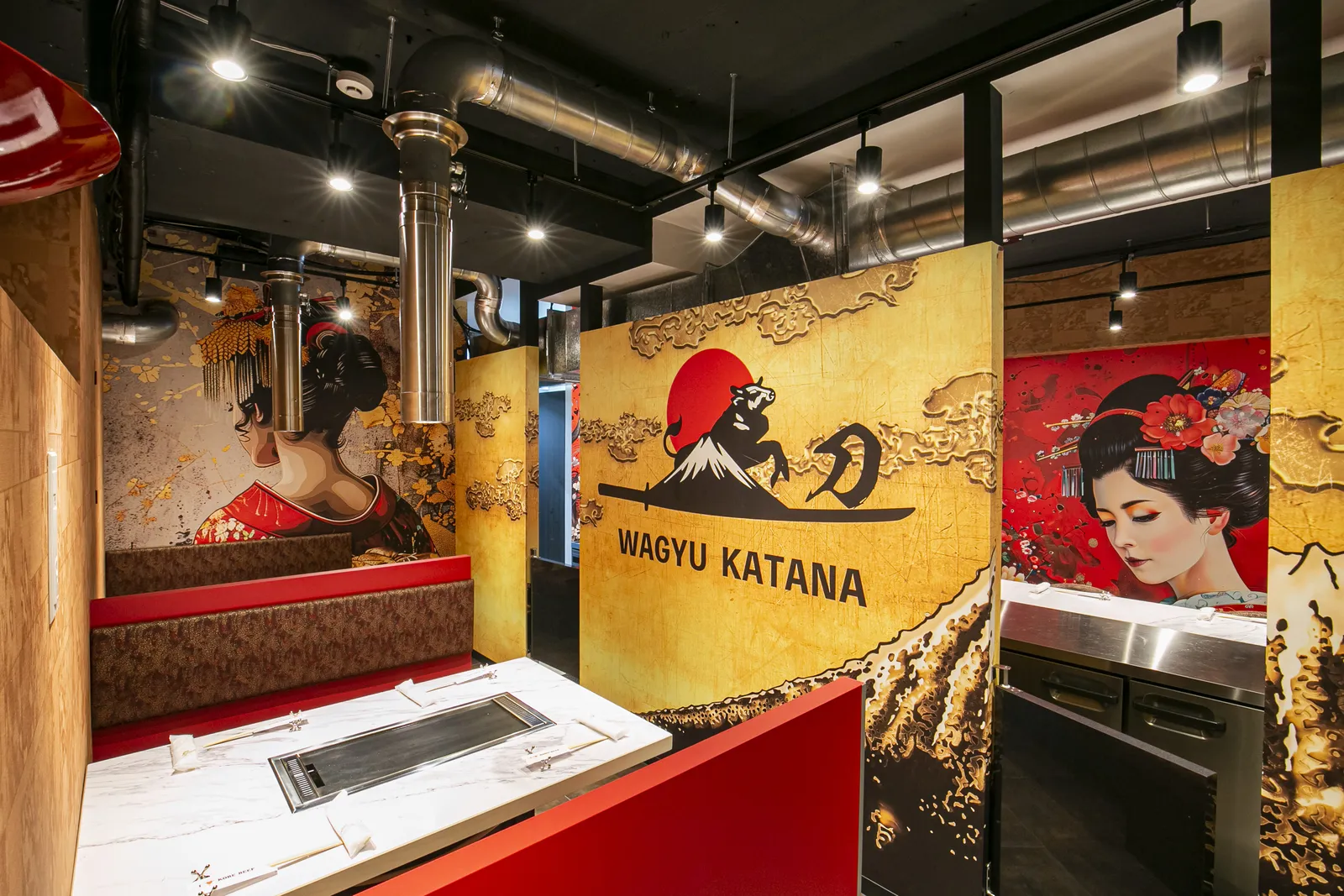 Semi-private teppan table with red banquette seating