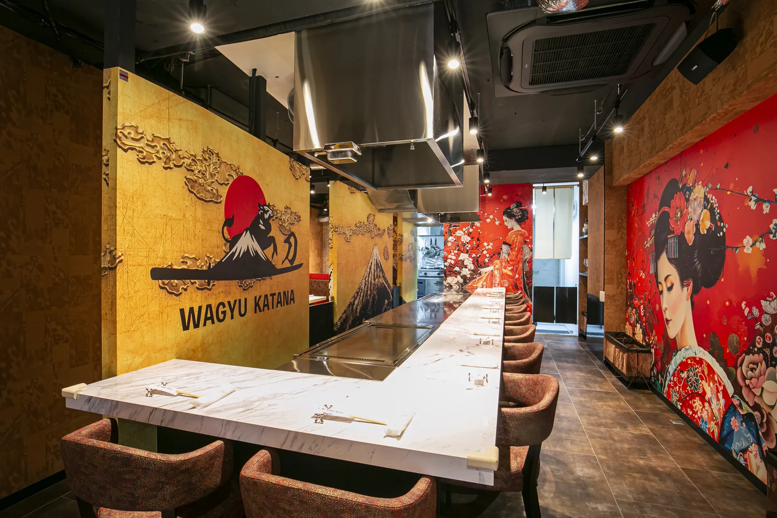 Marble-topped teppan counters running the length of the dining room